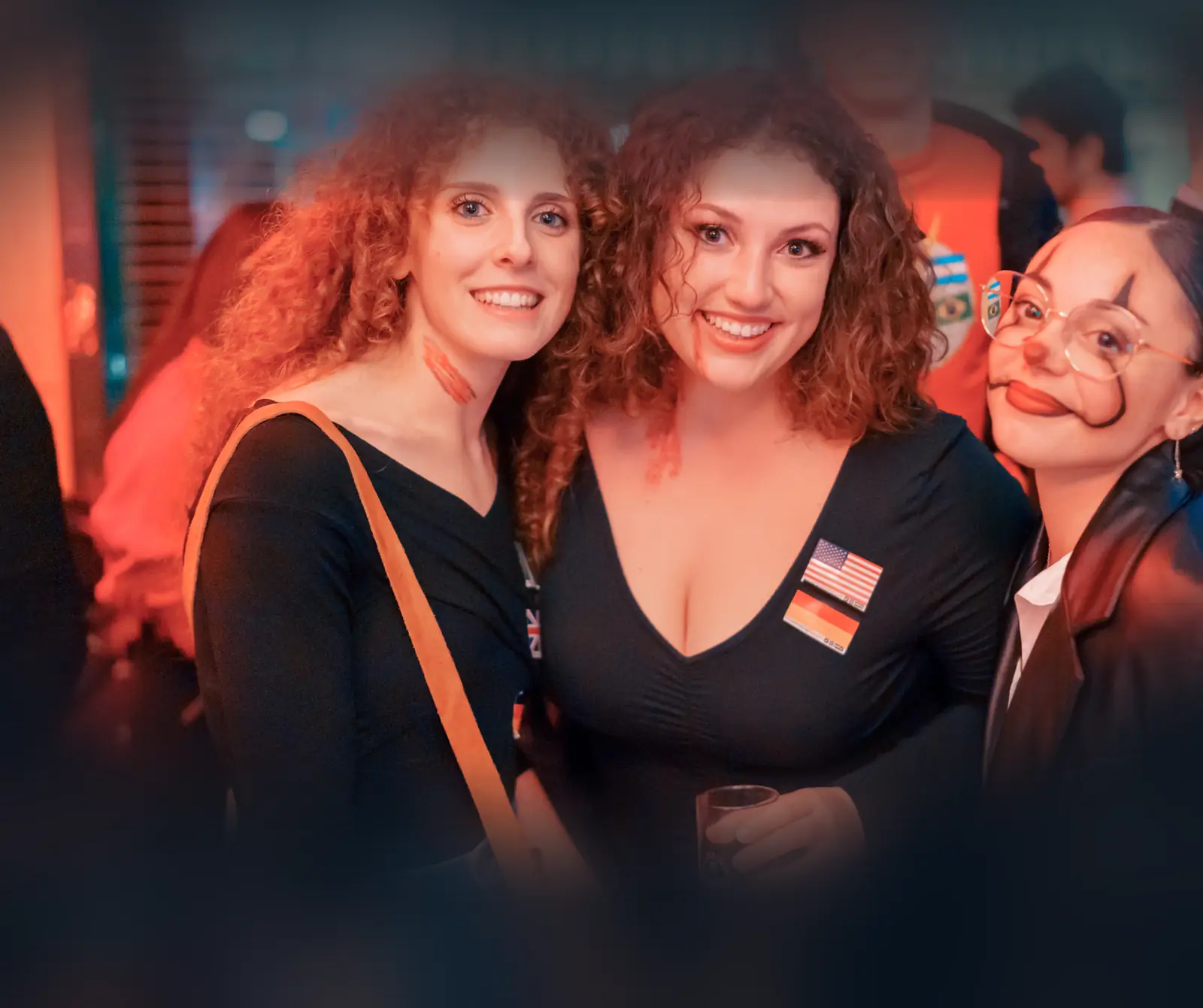 Three friends in Halloween face paint at a Social Melting Pot night in Cologne