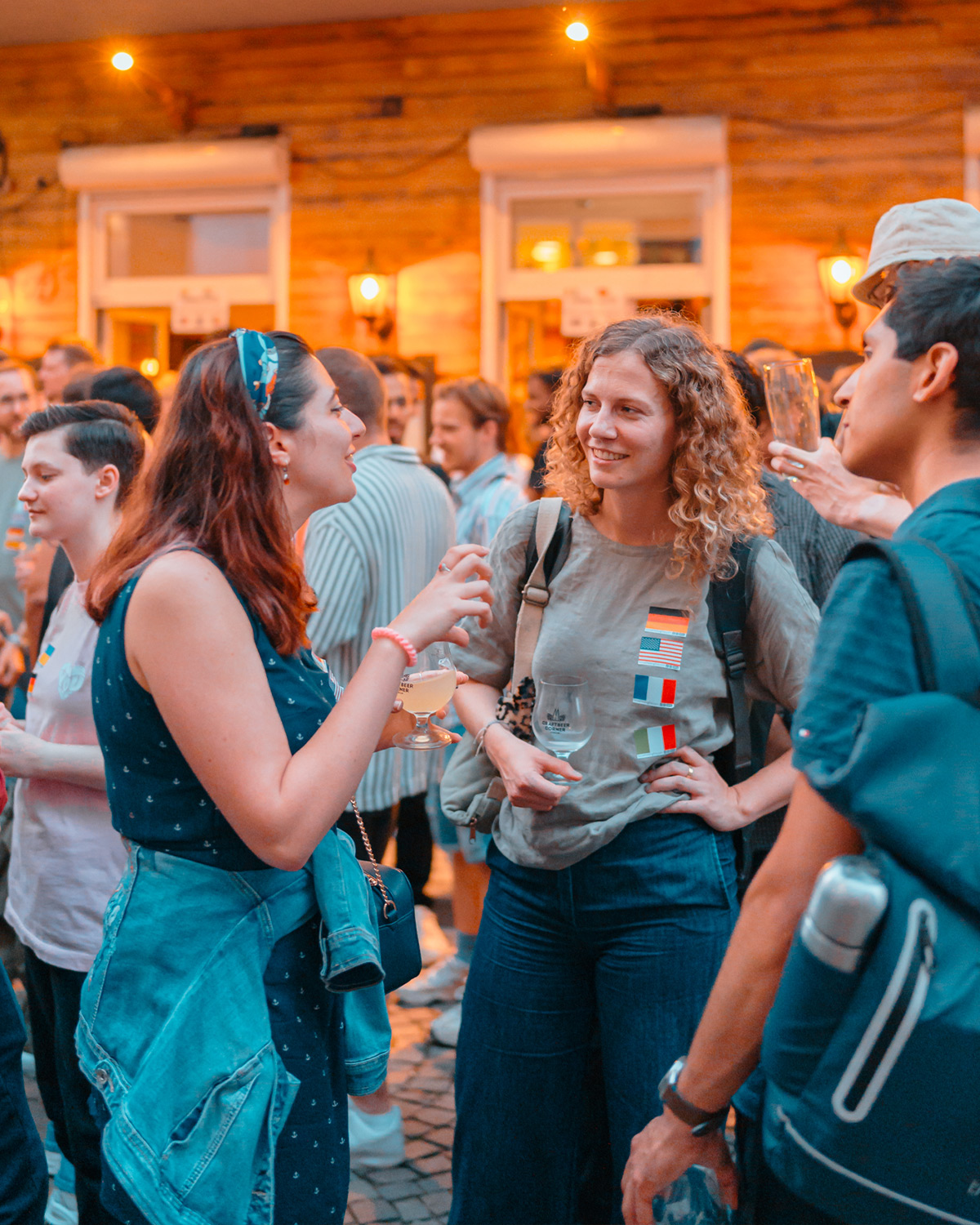 People talking and smiling during a Social Melting Pot evening in Cologne.